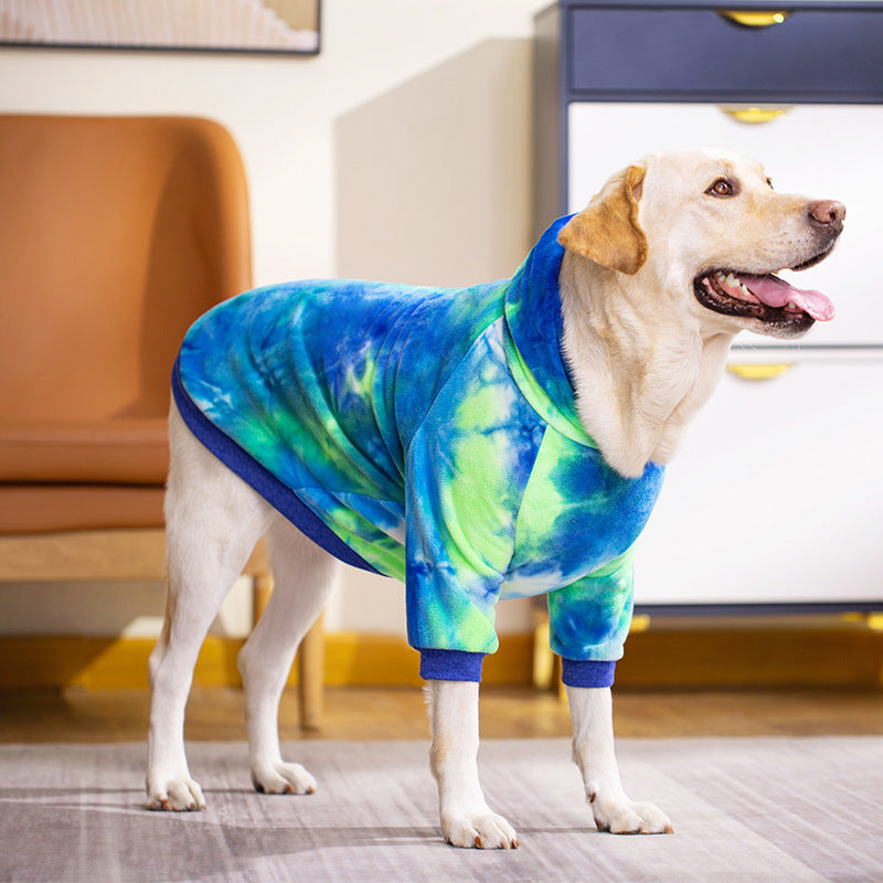 Tie-dye dog hoodie with hood, green and blue swirl pattern, ribbed blue cuffs, side view
