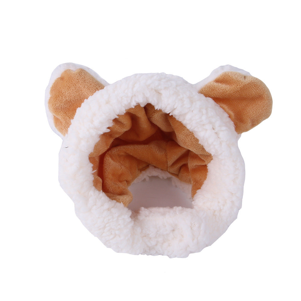 White plush pet hat with tan ear accents and a wide cozy hood opening