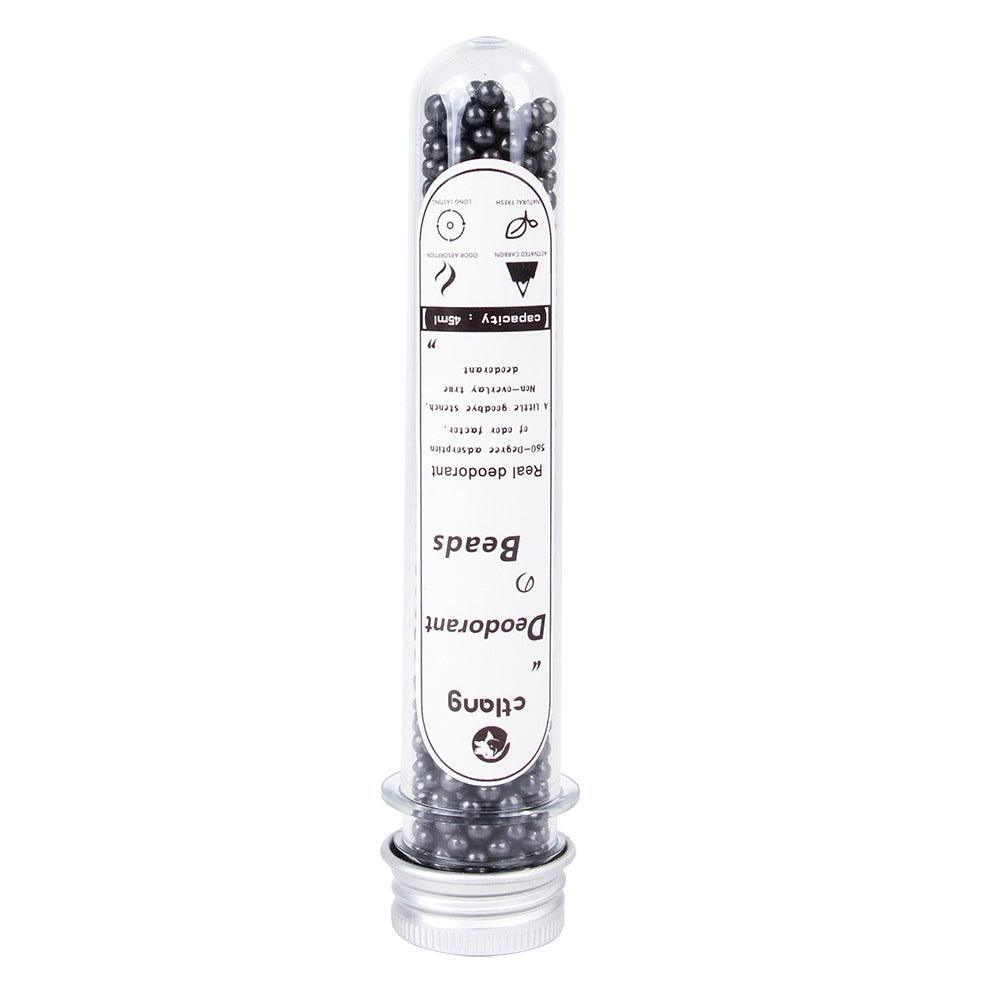 Activated carbon deodorizer vial, clear cap over black beads for cat litter freshness