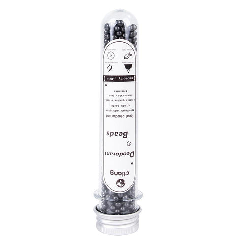 Activated carbon cat litter deodorizer tube with dark bead granules, capped base