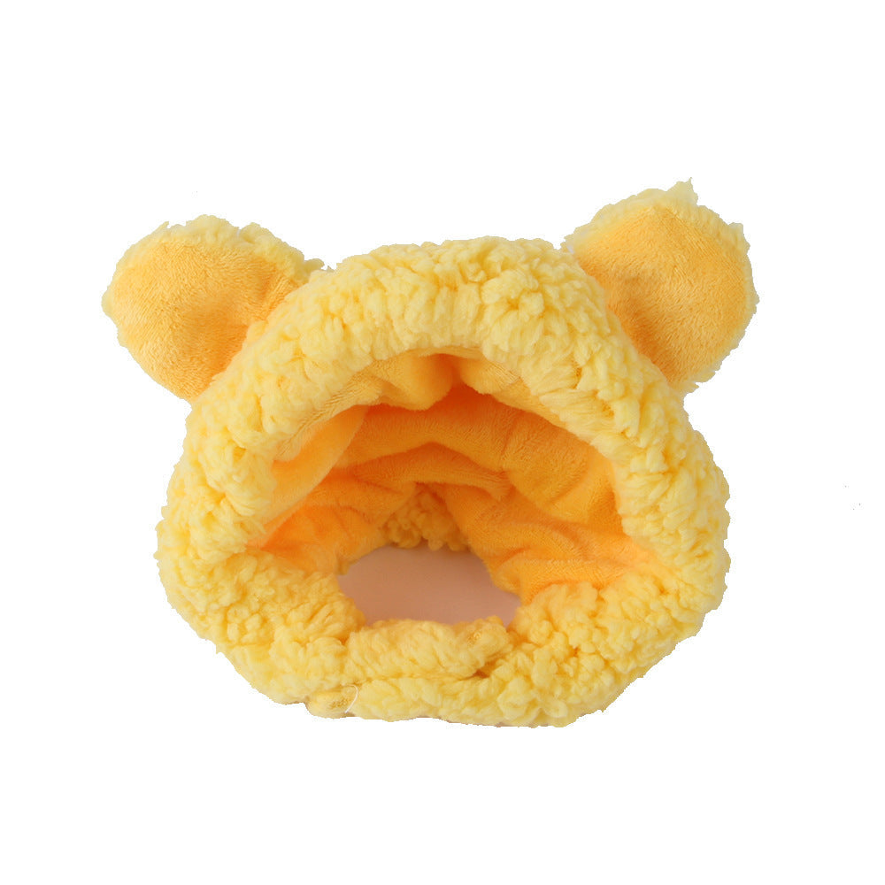 Yellow plush pet hat with rounded ears and an orange inner lining