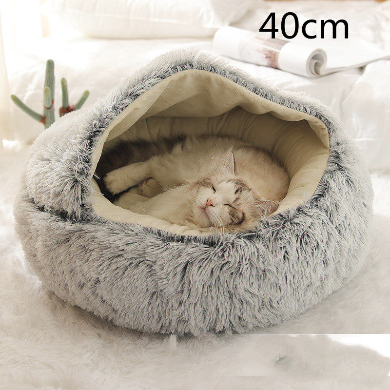 Gray shag plush round pet bed with open center and cushioned rim; sleeping pet inside