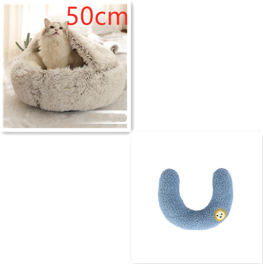 Gray round plush pet bed with cat; blue U-shaped bolster with smiley patch
