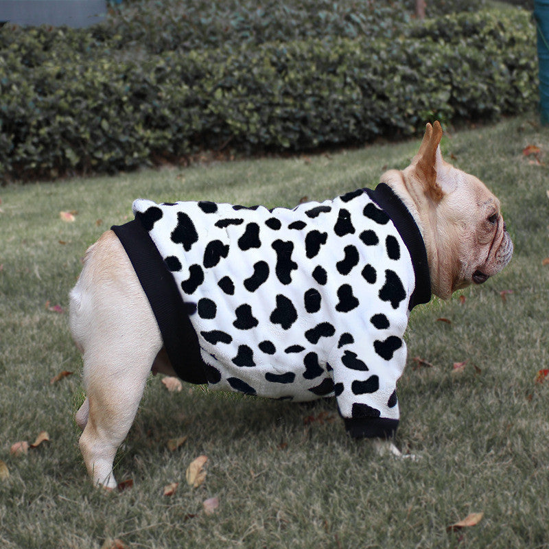 Fleece dog pajamas in white with black cow-spots and black outer trim
