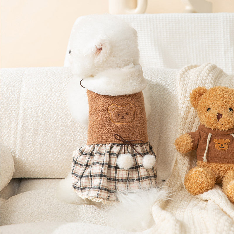 Puppy bear dress with white hood, brown top, and plaid skirt with pom-poms