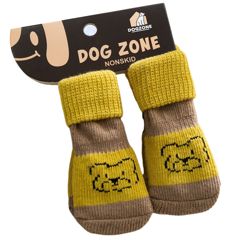 Pair of knit dog socks, yellow and brown with bear face patches and ribbed cuffs.