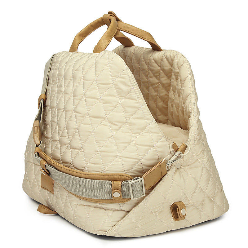 Cream quilted pet handbag with side strap and adjustable buckle