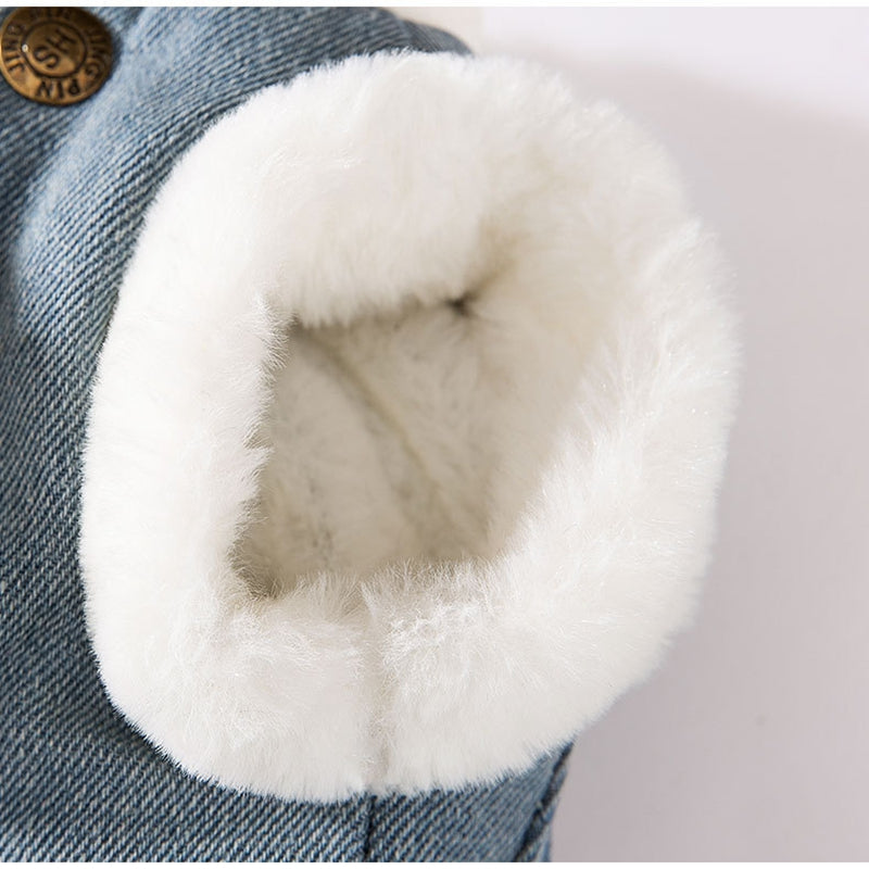 Blue denim pet vest with large white plush hood-like pocket and teddy applique