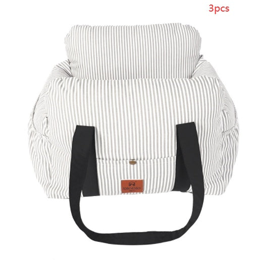 Striped grey dog car safety carrier with padded handle straps and front flap pouch