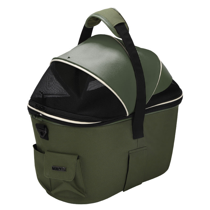 Green rear-mounted pet basket with front mesh window and padded black strap
