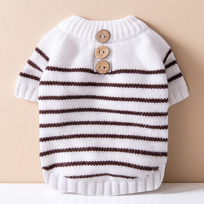 White dog knit sweater with brown-striped bands and three wood buttons
