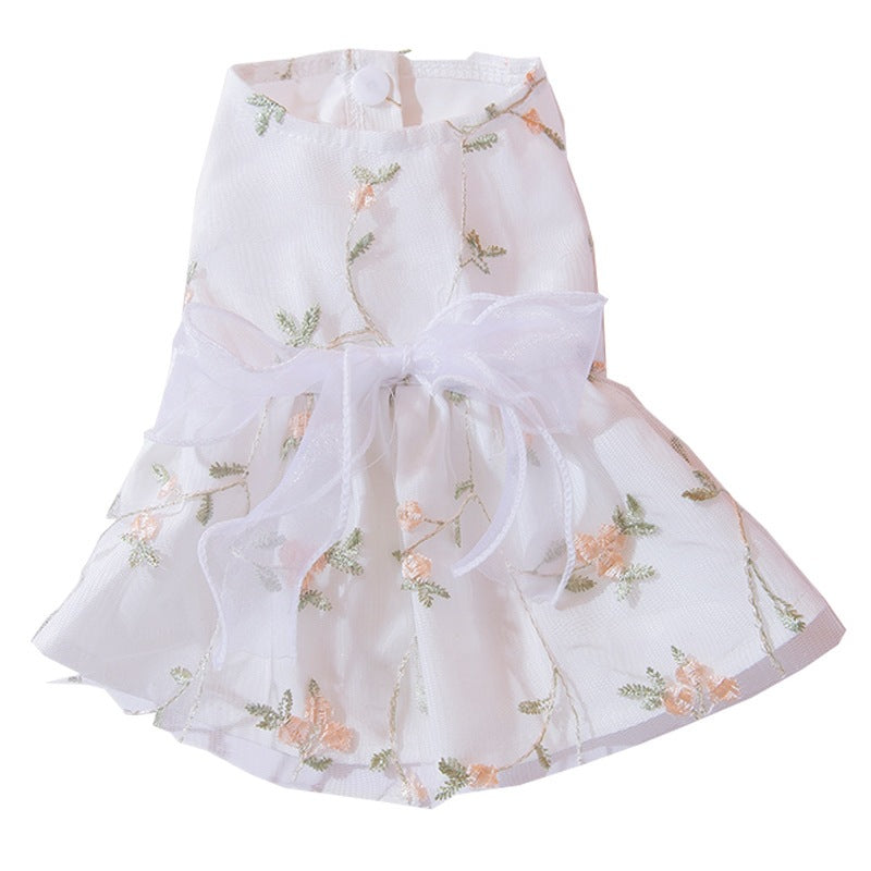 Double-layered princess-style dog skirt, white with floral sprig pattern and bow detail