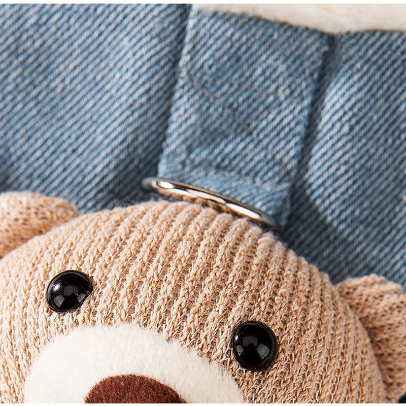 Denim pet vest close-up with knitted teddy paw applique and button details