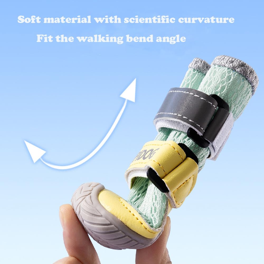 Hand holding a green and yellow mesh dog boot with Velcro strap and rubber sole