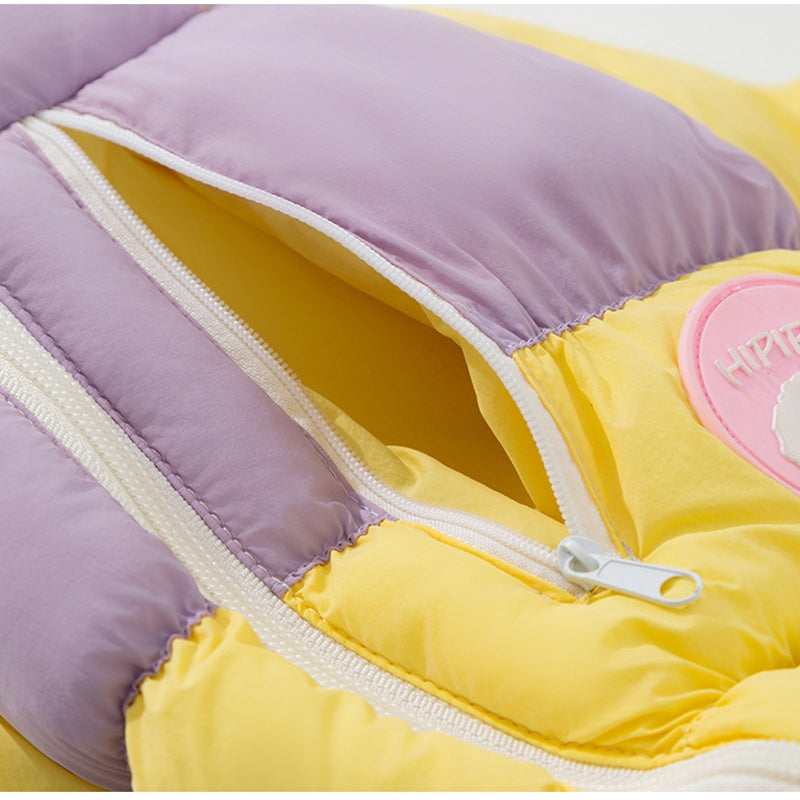 Color-block puffer dog jumpsuit close-up of double fabric panels and white zipper
