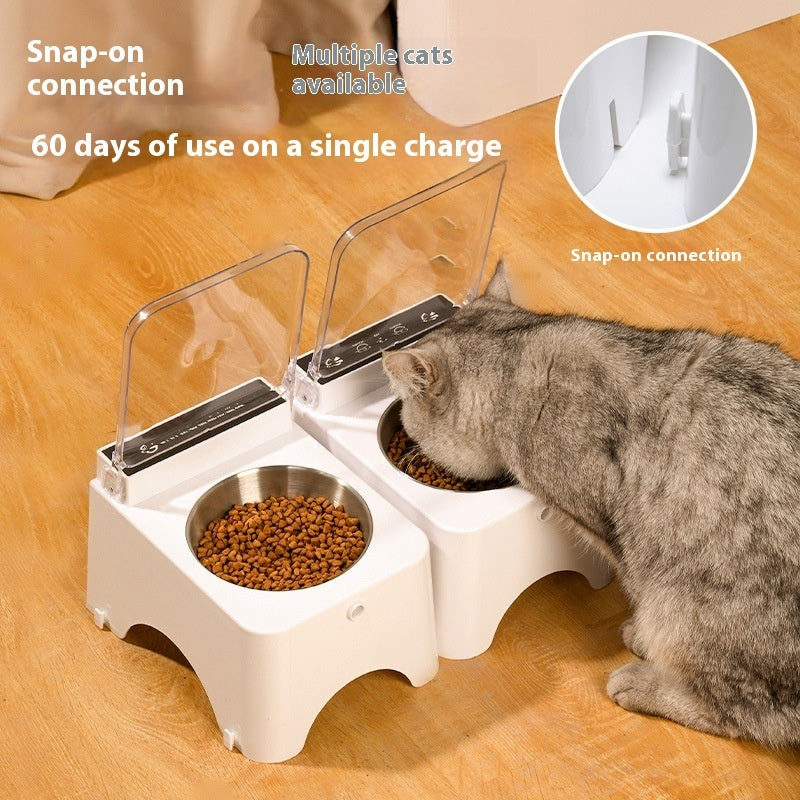 Automatic cat food feeder with open clear lid, dual bowls, white housing