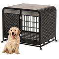 Front view: beige dog in front of grey dog crate table, barred door, perforated sides, rolling wheels