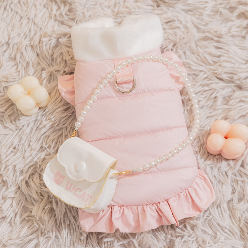 Pink puffer pet outfit with pearl trim, ruffled hem, and white pouch accessory