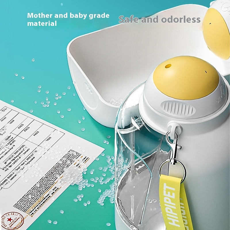 White pet water and food dispenser with yellow top button and integrated bowl