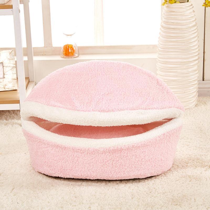 Light pink plush pet nest with white inner rim, round top view