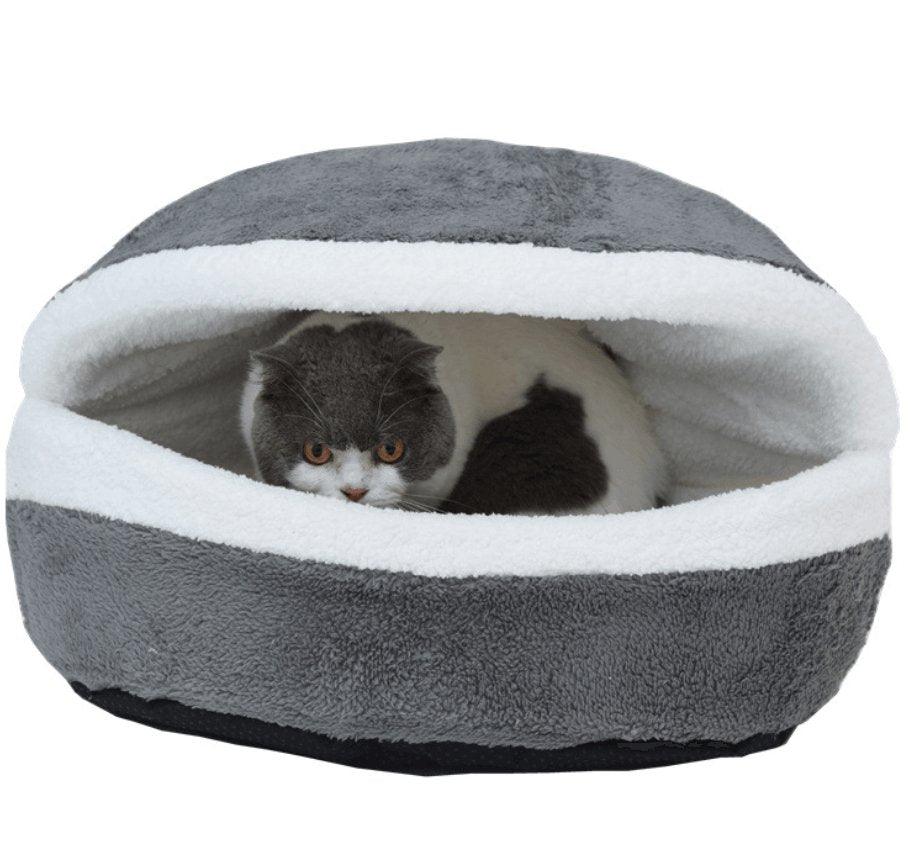 Gray plush pet nest with white inner rim, cat resting inside