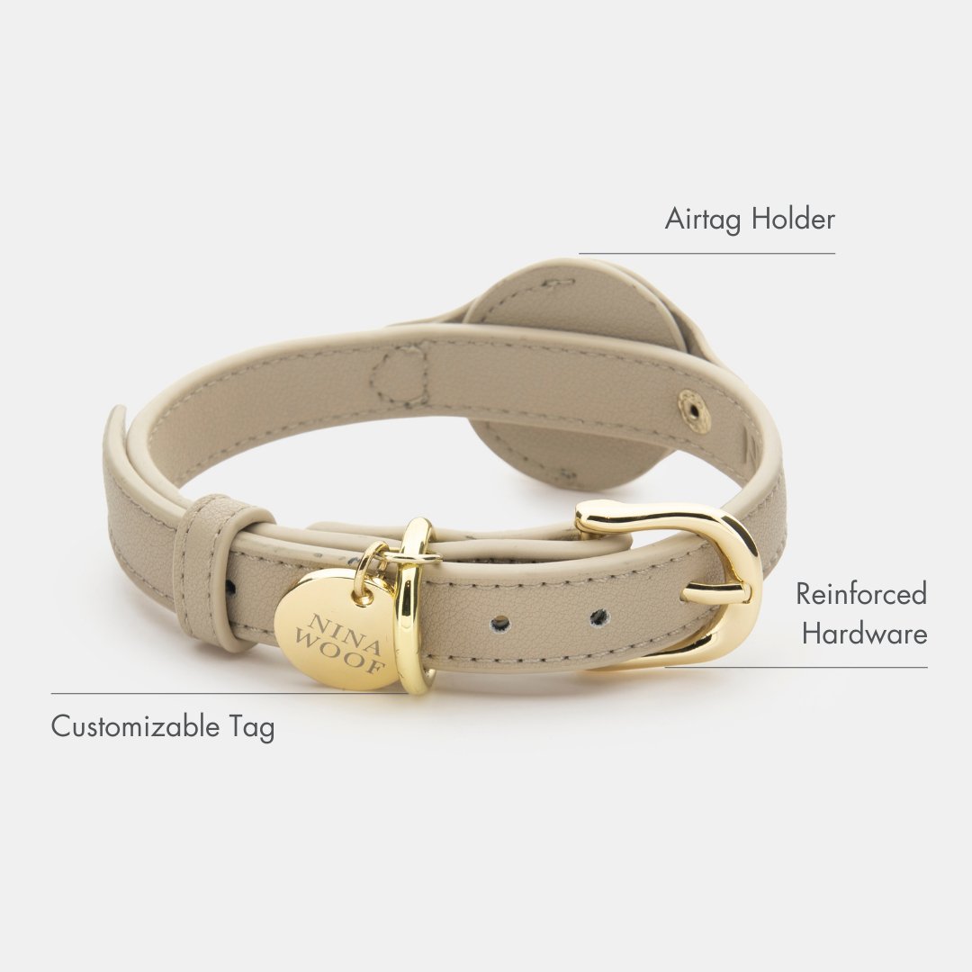 Beige vegan leather dog collar with AirTag holder, ring clasp, and reinforced hardware