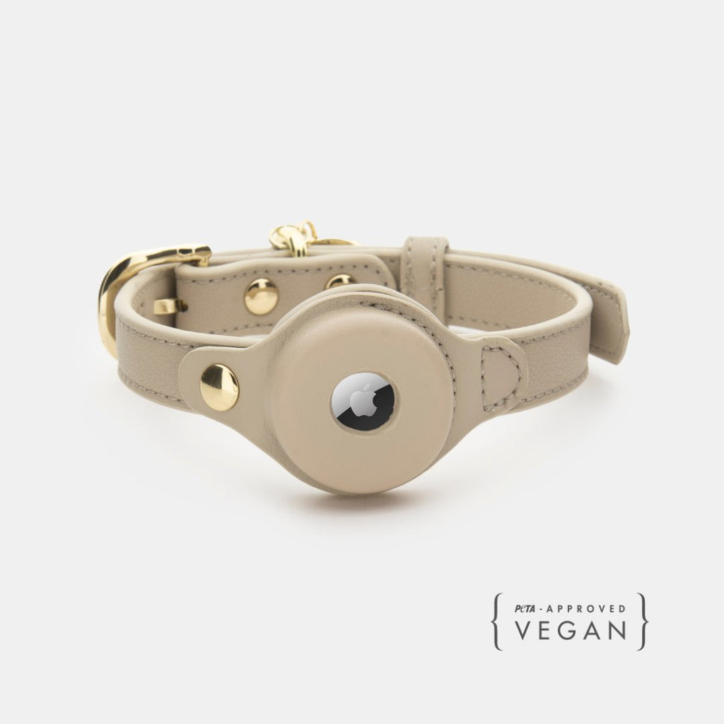 Beige vegan leather dog collar with AirTag holder and gold hardware, snap closure