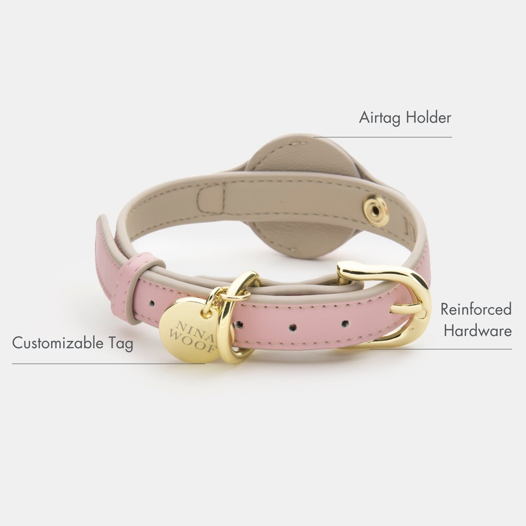 Pink vegan leather dog collar with AirTag holder, ring clasp, and reinforced hardware
