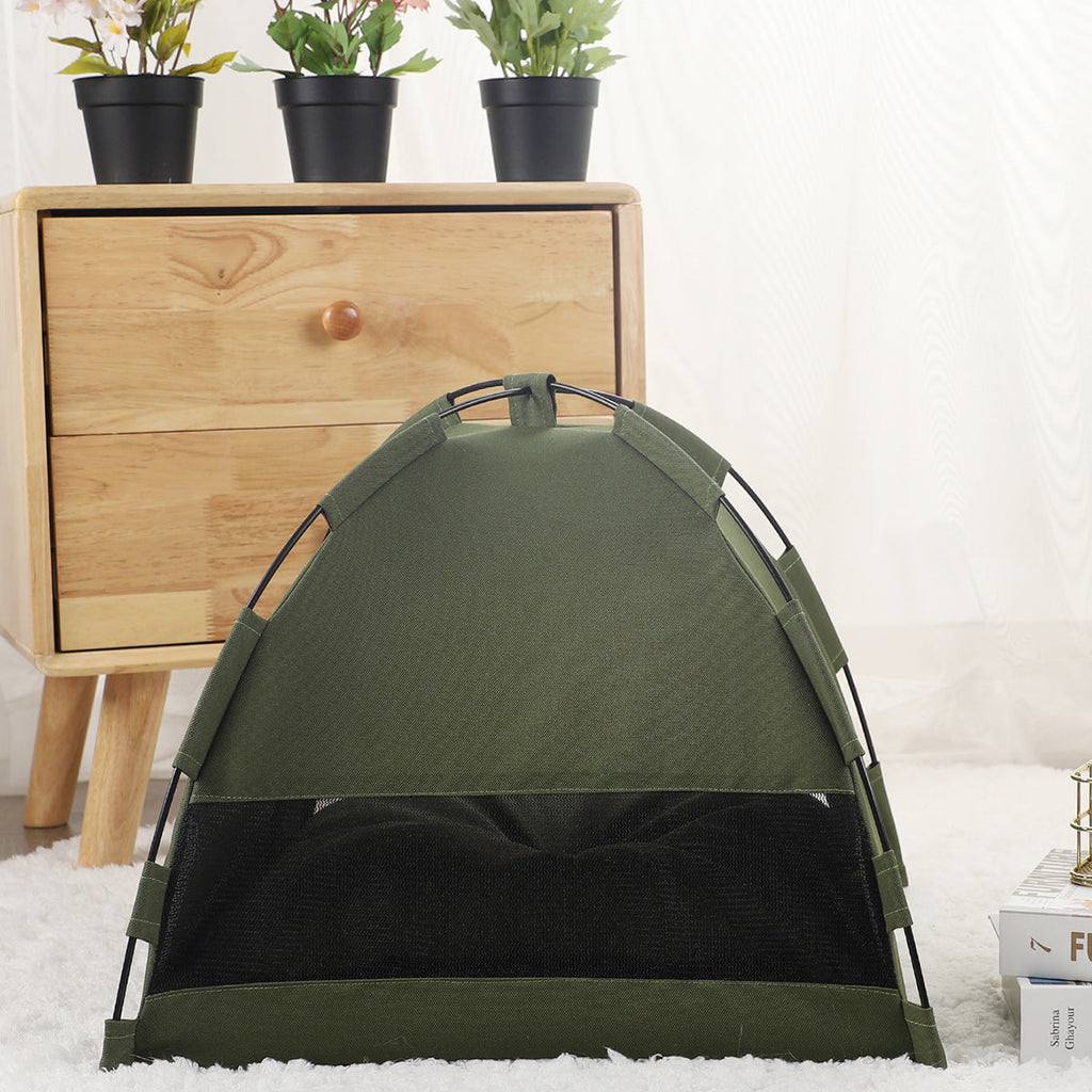 Green pet tent with arched front opening, padded base, and fabric side panels