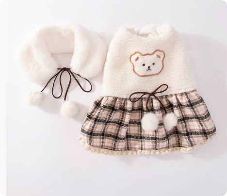 Beige plush pet dress with bear patch, plaid skirt, and lace-up hood detail