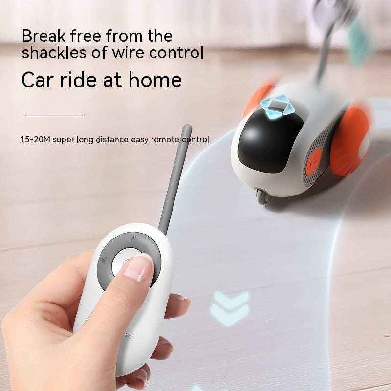 White remote-control cat car toy with orange bumper and handheld remote for control