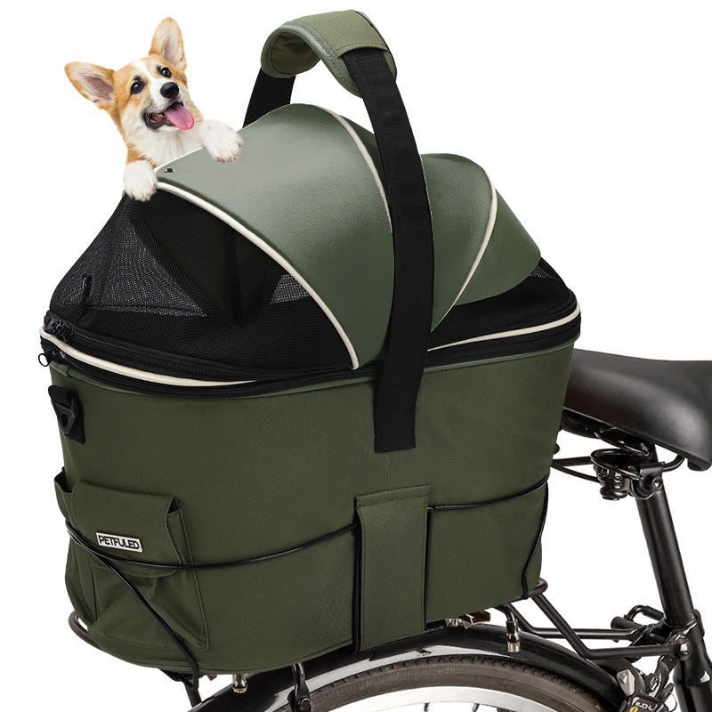 Green rear-mounted pet basket on bicycle with front mesh panel and padded handle strap