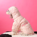 Floral hooded pet down jacket in pink, side view with front zipper