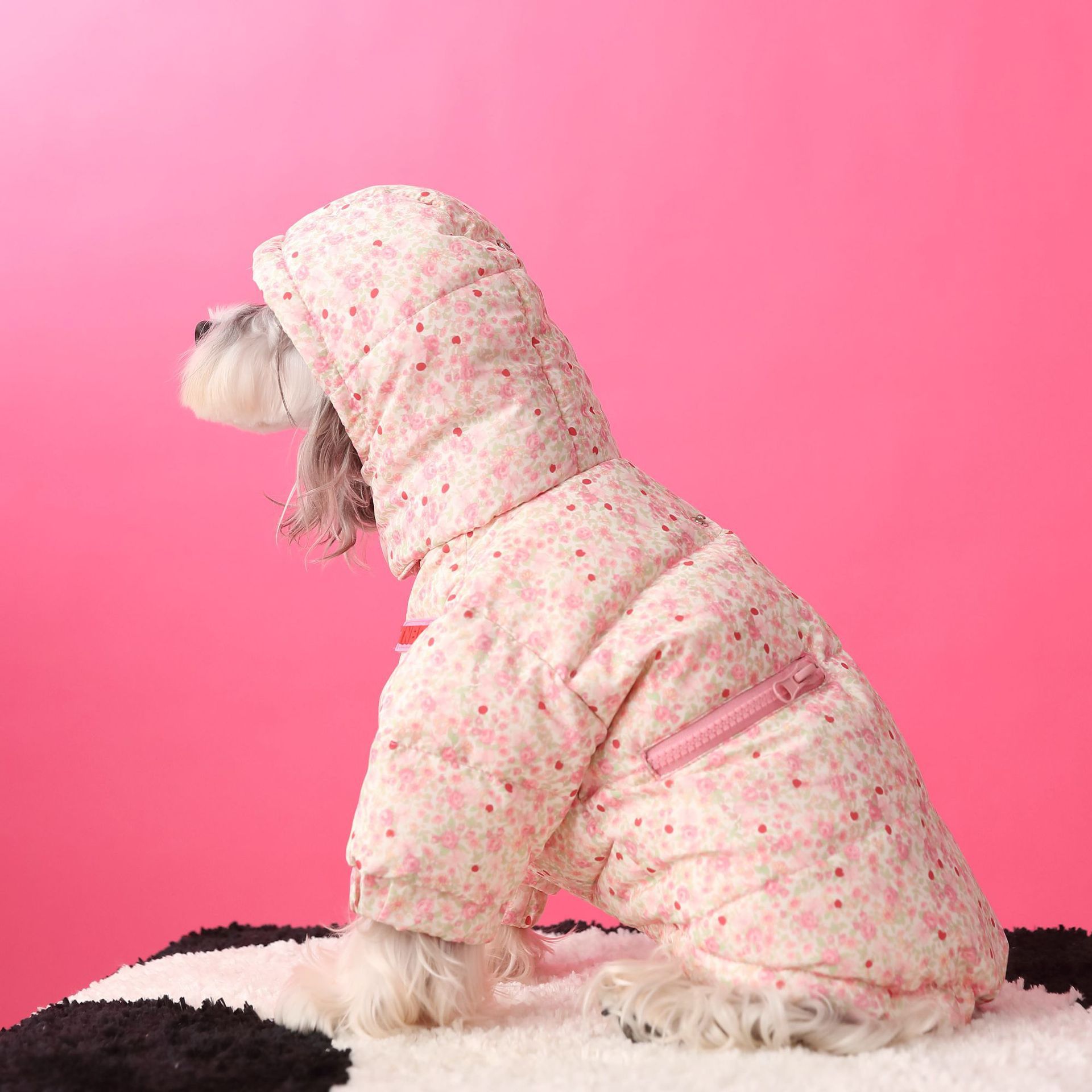 Floral hooded pet down jacket in pink, side view with front zipper