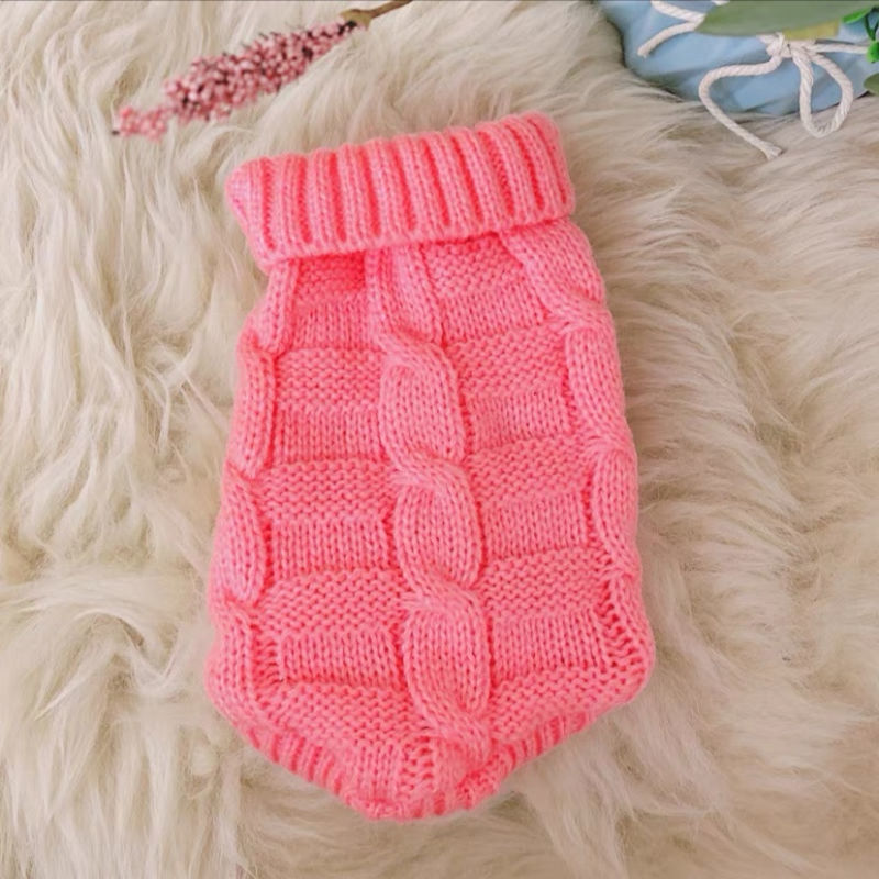 Knitted cat sweater in bright pink with ribbed turtleneck and raised panel pattern