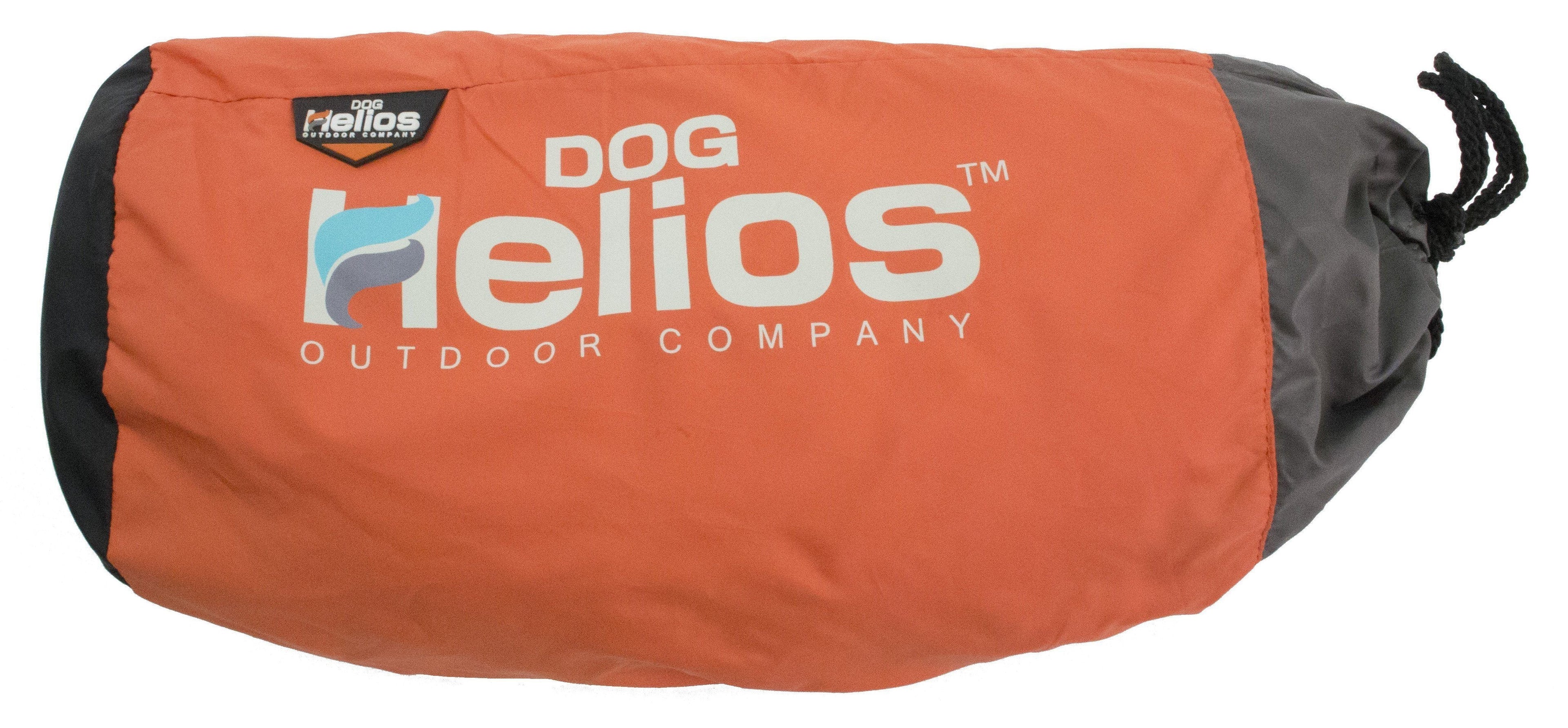 Rolled dog bed cover in orange fabric with DOG Helios outdoor company logo