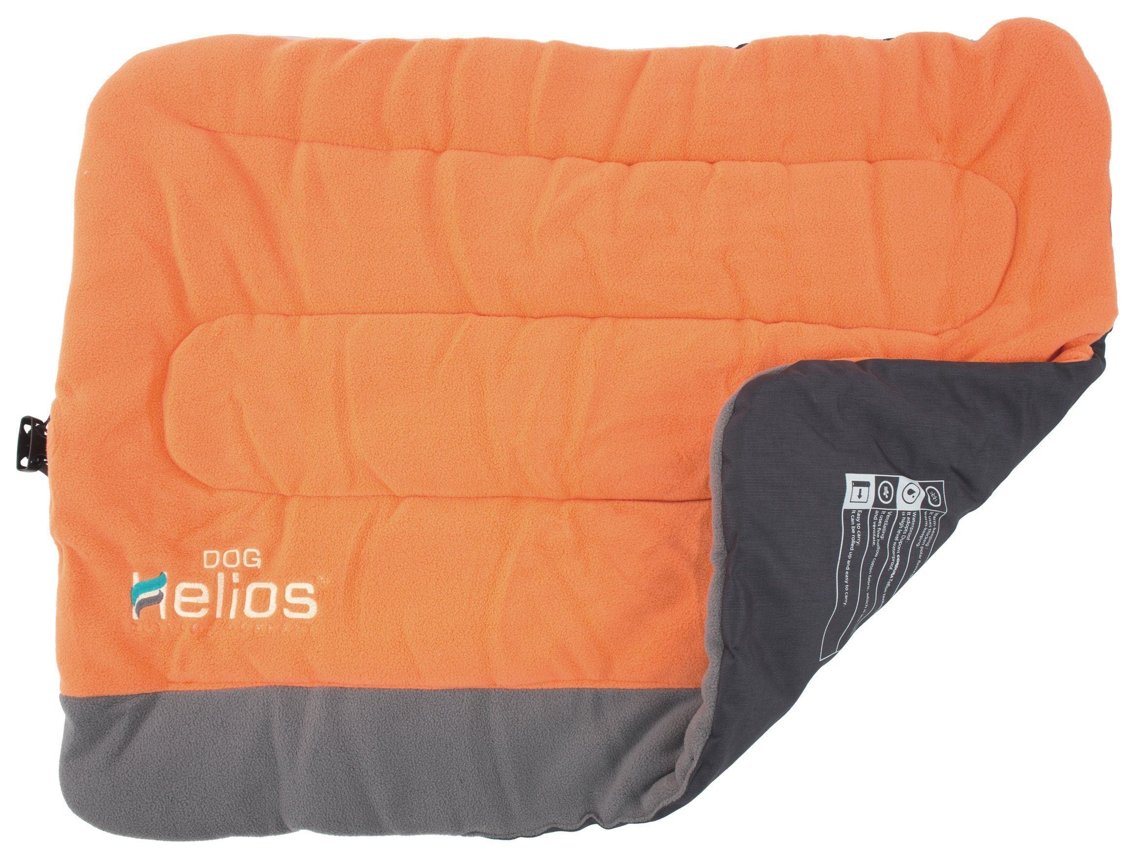 Reversible dog bed with orange fleece top and dark gray outer panel with care label