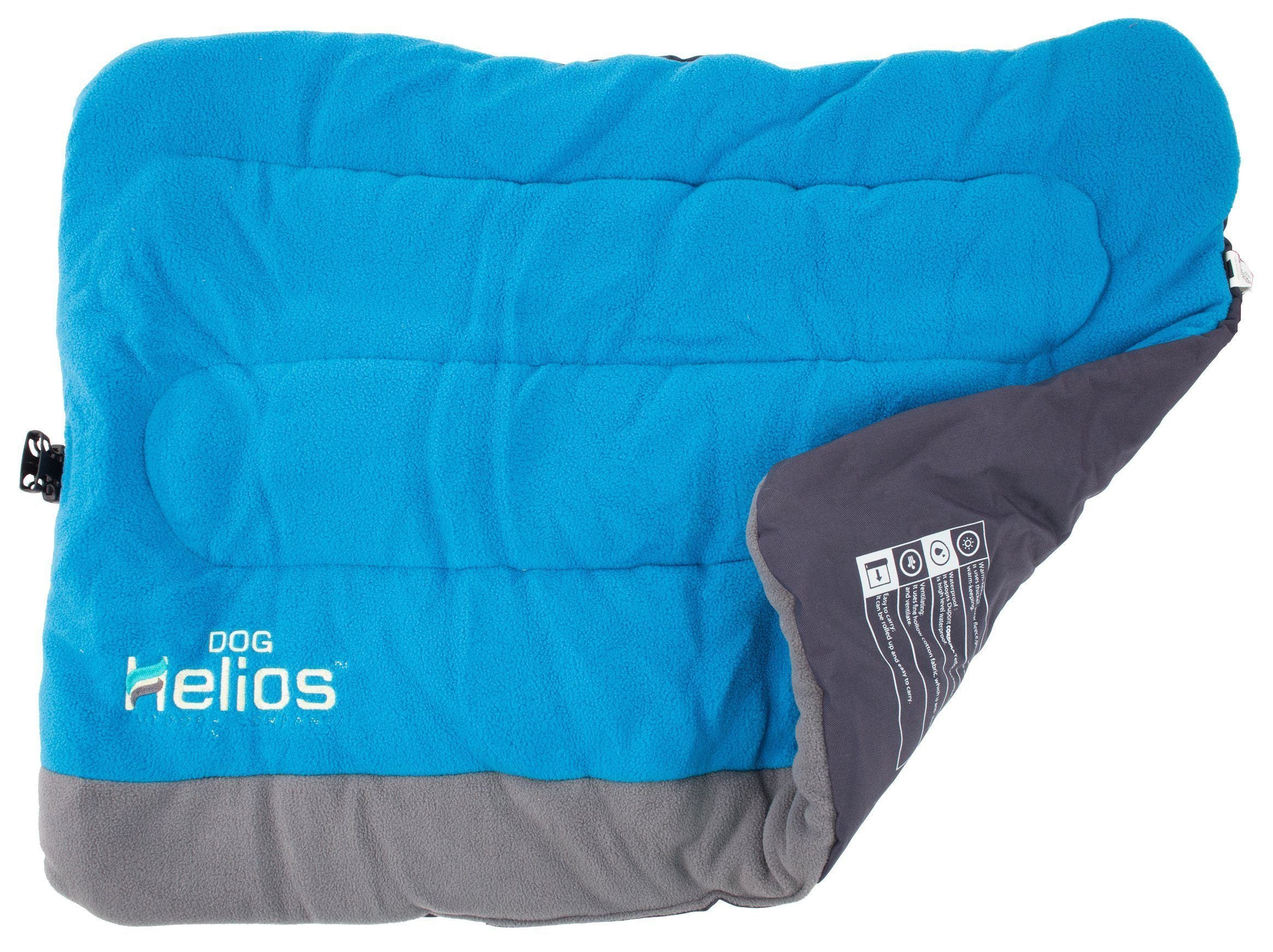 Reversible dog bed with blue fleece top and dark gray fold-over side panel