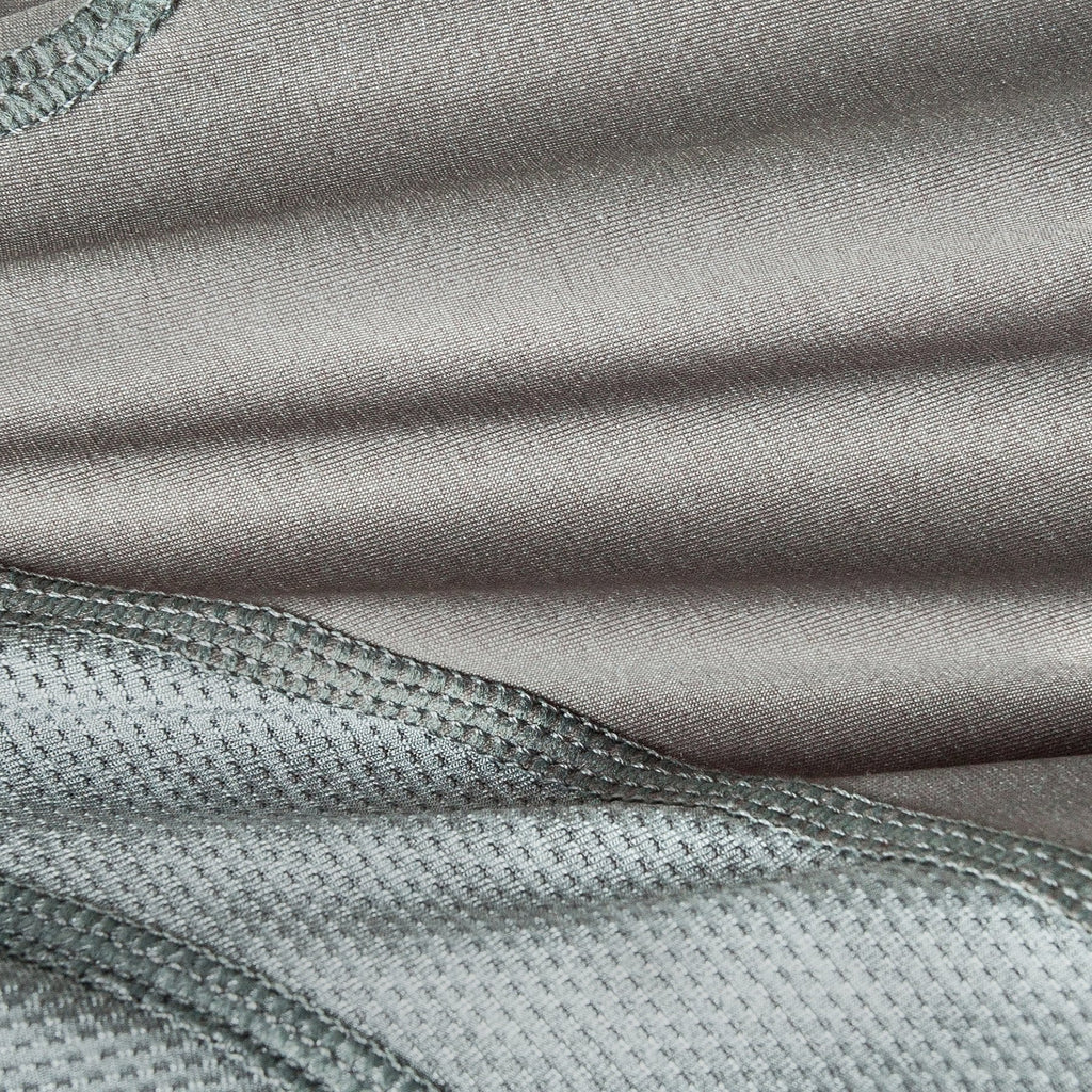 Grey dog yoga tracksuit fabric close-up with textured knit and stitching