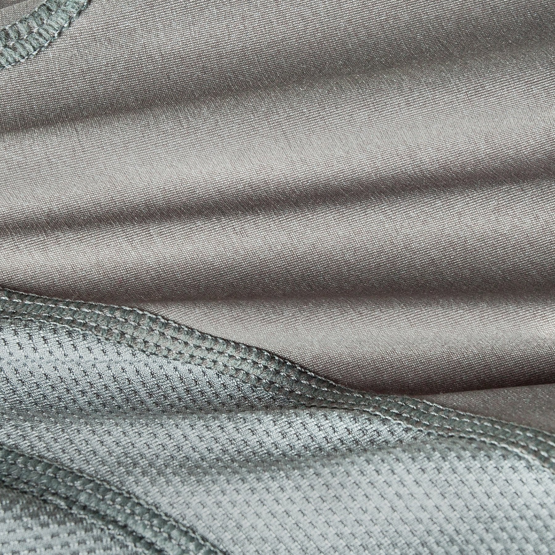 Grey dog yoga tracksuit fabric close-up with textured knit and stitching