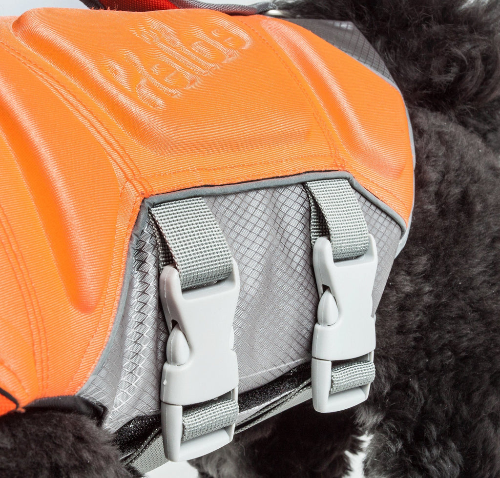 Close-up of orange life jacket vest with gray buckles and textured strap padding