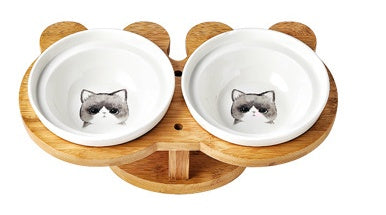 Ceramic cat bowl set with two white bowls featuring a gray cat face on each.