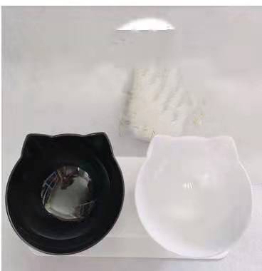 Raised double pet bowl stand with one black and one clear cat-shaped bowl