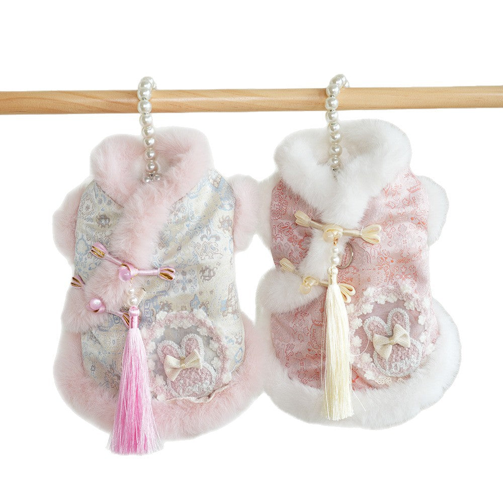Set of two pet jackets with pink patterned fabric, white faux-fur trim, tassels