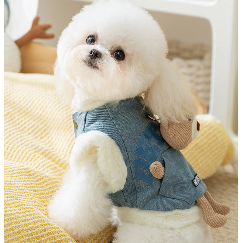 Dog model wearing blue denim pet vest with teddy bear pocket and bear toy decor