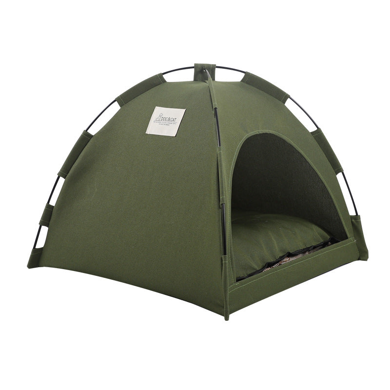 Green fabric cat tent with arched doorway and soft inner cushion, freestanding