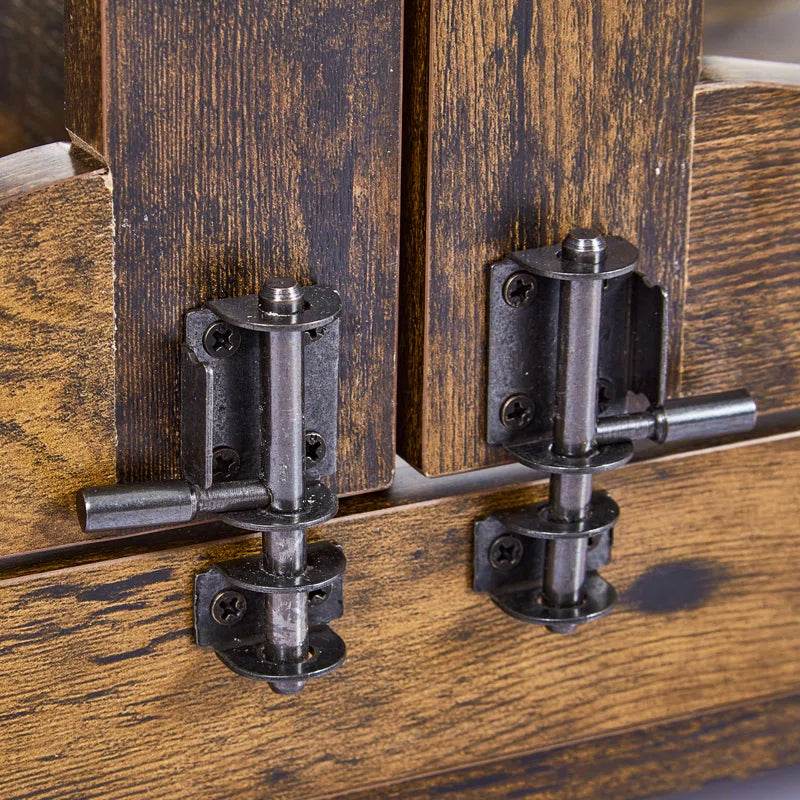Detail view of black metal hinges and latch hardware on rustic brown dog crate door