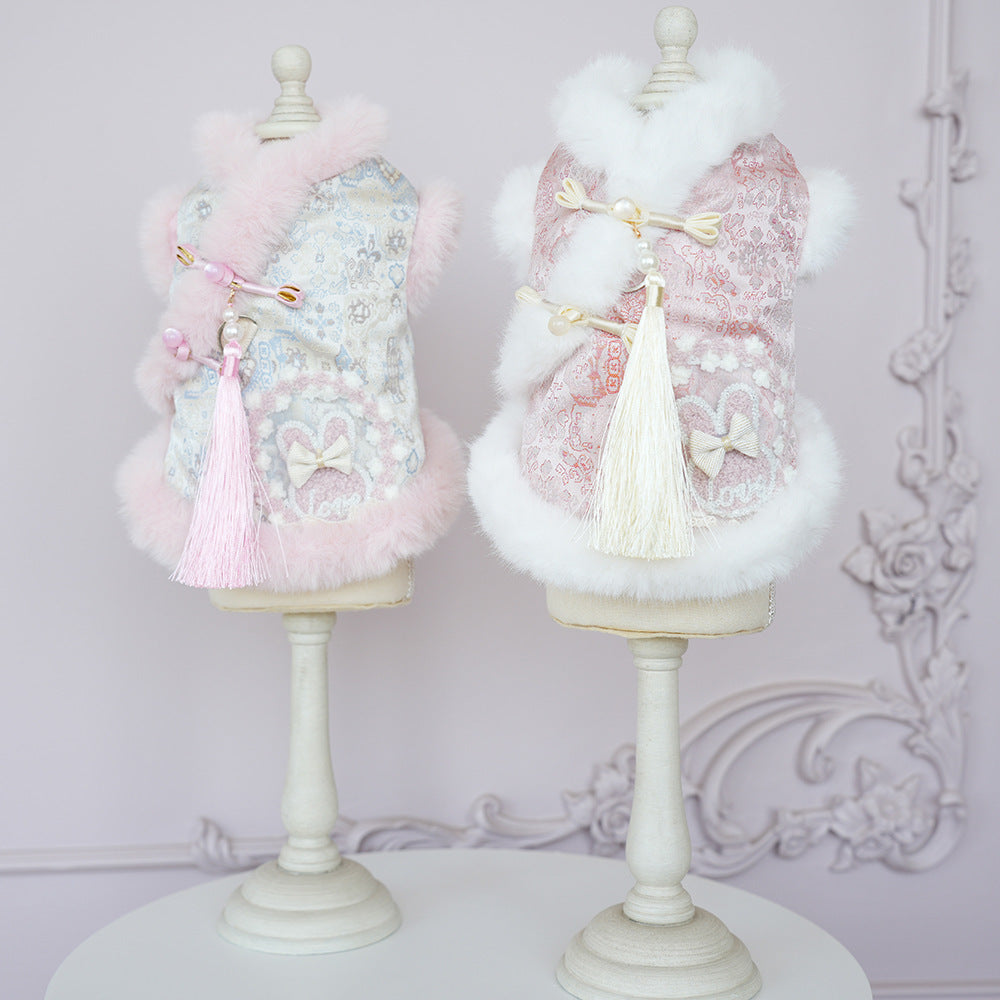 Light blue and pink patterned pet jacket with white faux-fur trim, tassel bow ties
