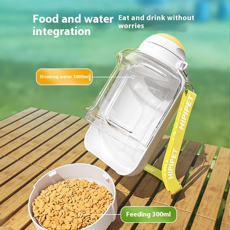 Clear 2-in-1 pet dispenser with drinking chamber and feeding compartment, yellow lid