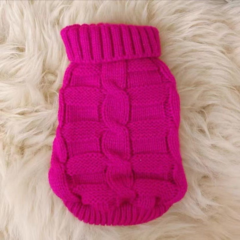 Pink knitted cat sweater with ribbed turtleneck and textured block pattern